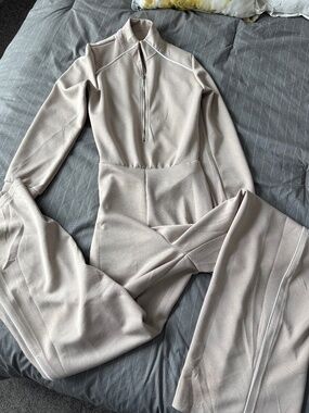 NWOT Beige jumpsuit with trapdoor